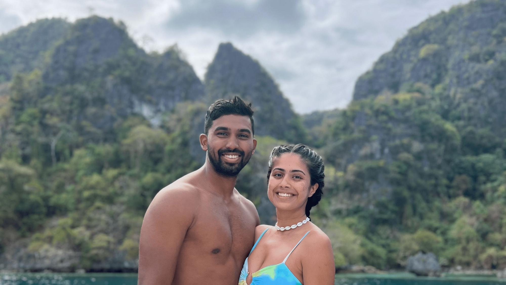 PADI AmbassaDivers Prachi and Harsh posing for a photo near the water.